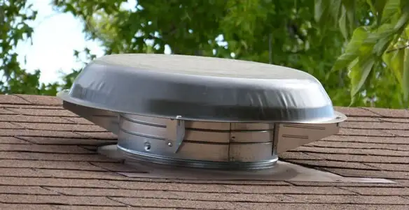 attic fan installation services with low-profile roof ventilation unit in Bakersfield, CA