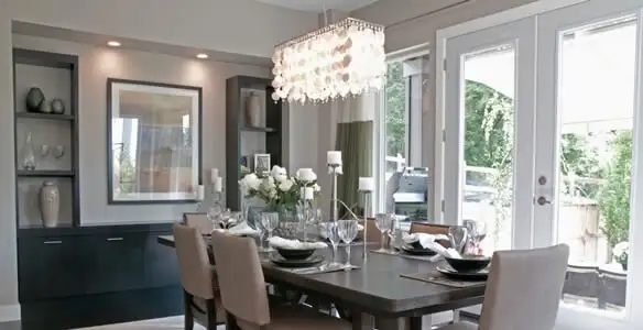 Elegant dining room chandelier installation above table in Bakersfield, CA