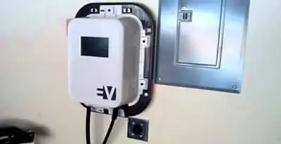 Electric car charger installation with wall-mounted EV charging station in Bakersfield, CA