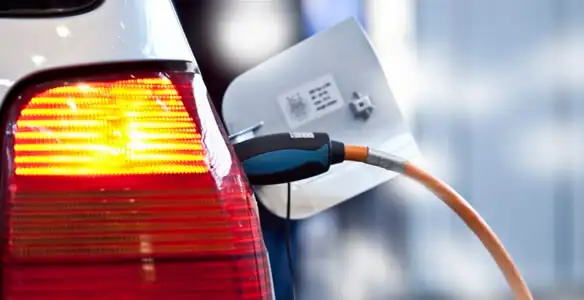 Electric car plugged into EV charger after professional installation in Bakersfield, CA