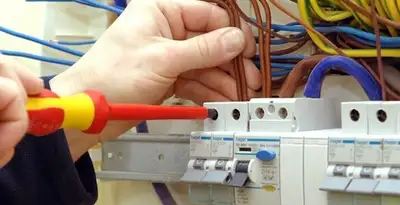 electrician services performing professional electrical panel wiring and connections in Bakersfield, CA