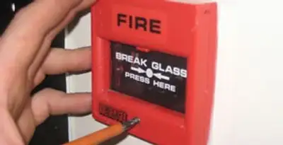 fire alarm installation service showing manual fire alarm pull station installed by licensed electricians in Bakersfield, CA