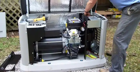 generator installation service showing technician connecting and configuring generator components in Bakersfield, CA