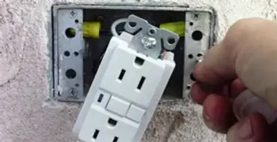 gfci circuits service showing installation of a ground fault circuit interrupter outlet by licensed electricians in Bakersfield, CA