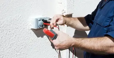 Electrician performing home electrical outlet and wiring inspection in Bakersfield, CA