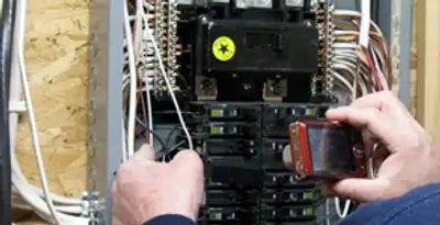 Home electrical inspection of circuit breaker panel by licensed electrician in Bakersfield, CA