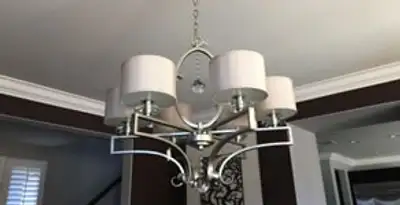 Modern chandelier installation with multiple light fixtures in Bakersfield, CA
