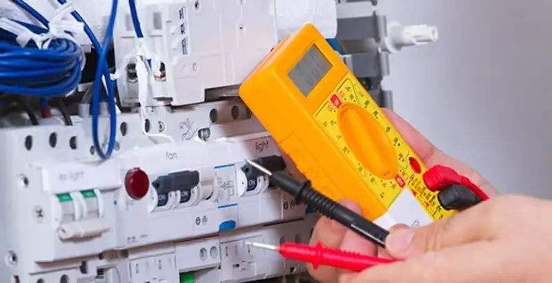 Residential electrician testing home electrical panel for safety and performance in Bakersfield, CA