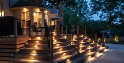 Residential electrician installing outdoor lighting for home safety in Bakersfield, CA