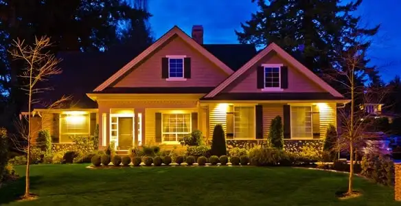 security light installation services illuminating a residential exterior at night in Bakersfield, CA