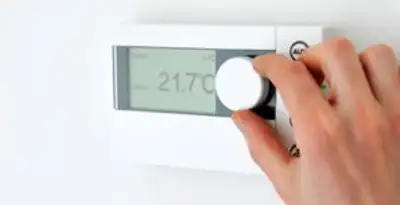 Thermostat installation service with professional adjusting temperature control in Bakersfield, CA