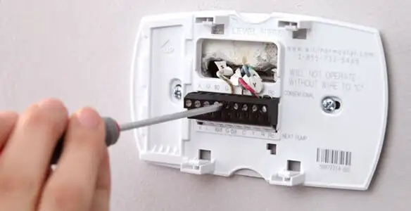 Thermostat installation service with proper wiring and secure wall mounting in Bakersfield, CA